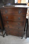 An early 20th Century oak bedroom chest of six long drawers, having Art Deco style drop handles,