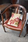 An Edwardian mahogany tub chair having rail back, and overstuffed seat (needs reupholstering)
