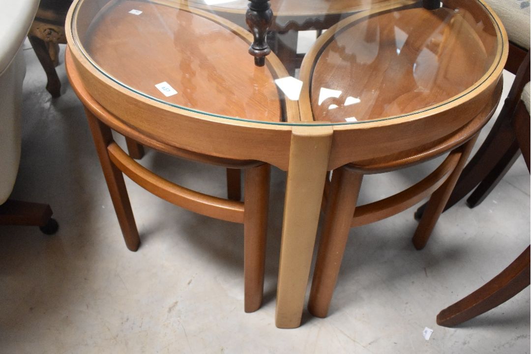 A vintage mid century (1960s Danish style) teak Nathan Trinity circular glass coffee table nest of - Image 1 of 3