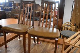 A pair of vintage teak slat back dining chairs , probably G plan