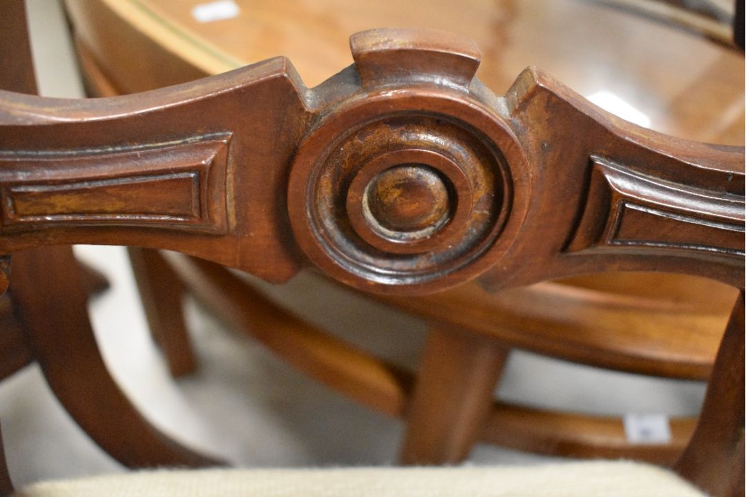A set of four Victorian mahogany balloon back dining chairs having later tapestry foliate decoration - Image 2 of 4