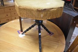 A tradtional Gipsy table having octagonal felted top and turned tripod base, diameter approx. 50cm