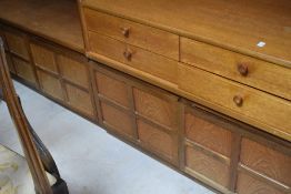 A vintage teak low sideboard having four drawers over double cupboard, width approx. 101cm