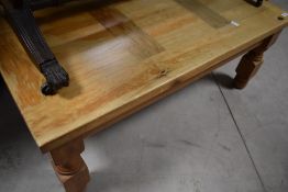 A modern pine coffee table, approx. 100 x 60cm, could do with a revarnish or paint