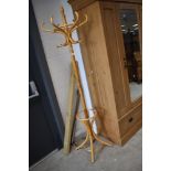 A modern bentwood hat stand , light stain