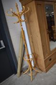 A modern bentwood hat stand , light stain