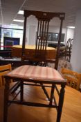 An Edwardian mahogany bedroom chair having later upholstered seat