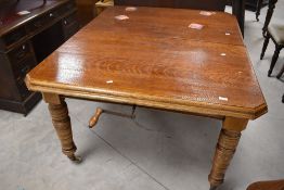 A Victorian oak windout dining table, approx. 116 x 143 (plus 2 additional leaves of 41cm each),