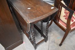 An early 20th century oak gateleg table, width approx. 78cm