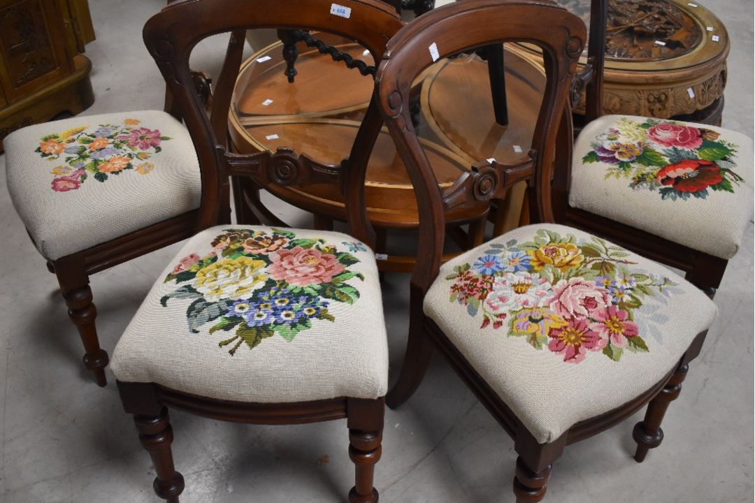 A set of four Victorian mahogany balloon back dining chairs having later tapestry foliate decoration - Image 1 of 4