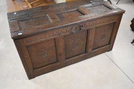 A period oak three panel coffer of nice proportions, having rosette carvings to panels and