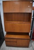 A vintage (mid Century) teak cabinet , believed to be William Lawrence, having lift flap upper