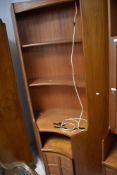 Three vintage teak Nathan wall units comprising corner and joining section, and narrow cabinet