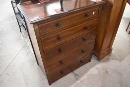 An Edwardian mahogany bedroom chest of five drawers, and a similar period bedroom chair with