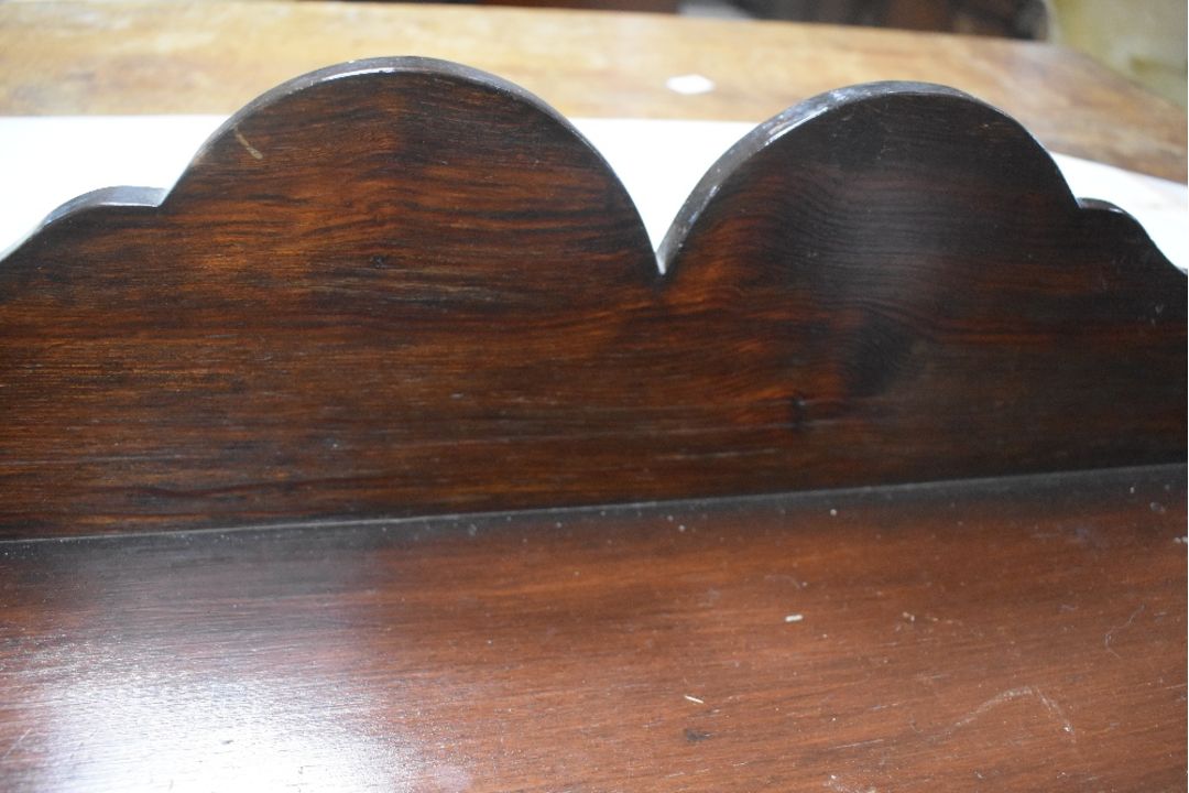 A Victorian dark stained pine chest of three long drawers, having shaped ledge back and turned - Image 4 of 4