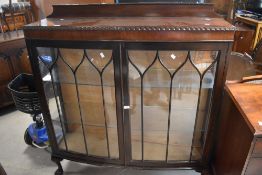 An early 20th Century mahogany display cabinet , on ball and claw feet, dimensions approx. width 121