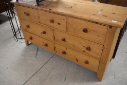 A modern pine multi drawer low bedroom chest or sideboard,dimensions approx. Width 140 height 75