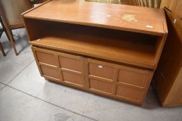 A vintage Nathan low TV or similar side cabinet , having open shelf over square panelled door,