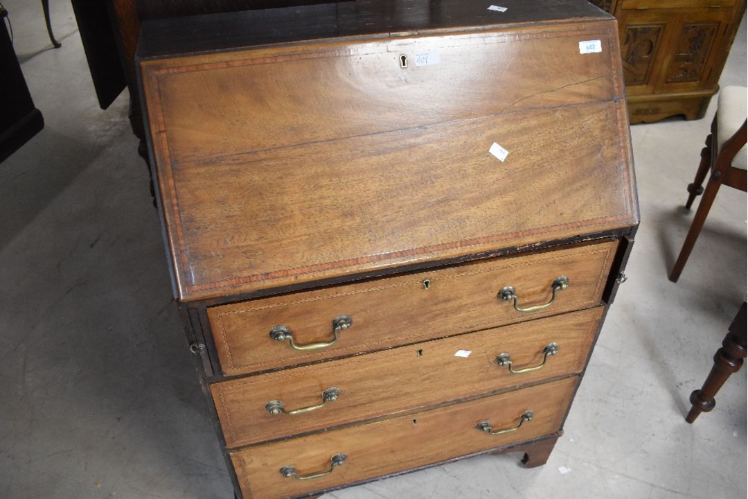 An Edwardian mahogany bureau of small proportions having typical drop flap over three long drawers - Image 1 of 2