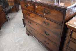 A Georgian mahogany chest of two over three drawers having brass drop handles, on bracket feet,