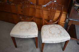 A reproduction mahogany dining chairs in the Hepplewhite style