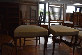 A harlequin set of Edwardian mahogany salon chairs, including one armchair