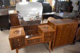 A vintage two piece sapele bedroom suite, comprising dressing table and four drawer chest,