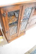 An Old Charm or similar hifi or display cabinet , dimensions approx. Width 57 depth 48 height 98cm