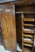 An early 20th Century walnut wardrobe, with oak fitted interior