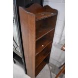 An early 20th Century oak narrow bookshelf of small proportions, dimensions approx. Height 109cm