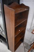 An early 20th Century oak narrow bookshelf of small proportions, dimensions approx. Height 109cm