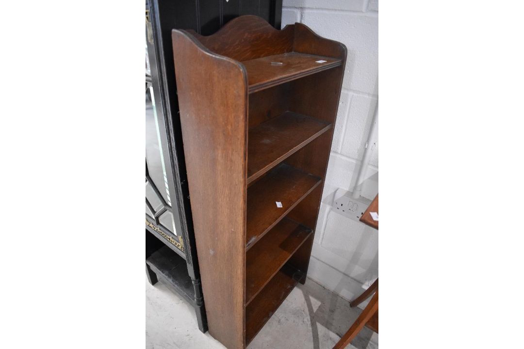 An early 20th Century oak narrow bookshelf of small proportions, dimensions approx. Height 109cm