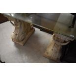 A pair of resin stonework console table legs of ornate form , having glass top, overall dimensions