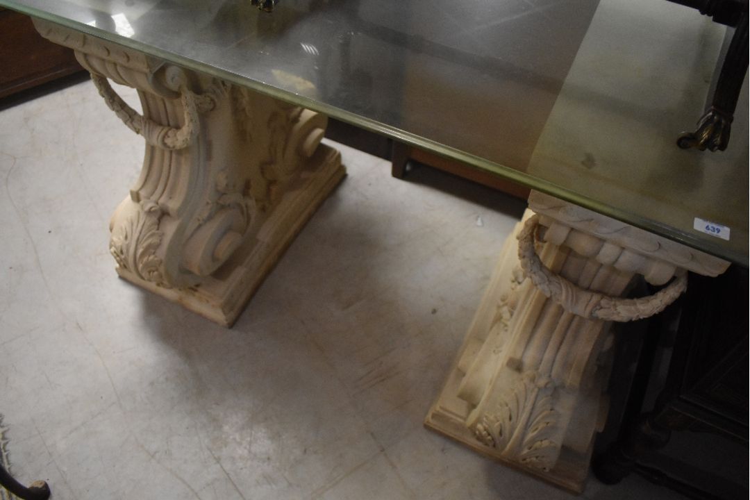 A pair of resin stonework console table legs of ornate form , having glass top, overall dimensions - Image 1 of 2