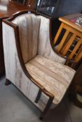 An early 20th Century mahogany framed easy chair , having later upholstery