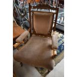 A Victorian mahogany framed easy chair having later dralon upholstery