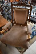 A Victorian mahogany framed easy chair having later dralon upholstery