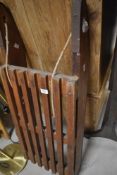 A vintage wooden sledge having metal runners