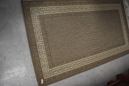 A modern nylon rug, in greek key design, approx. 147 x 81cm