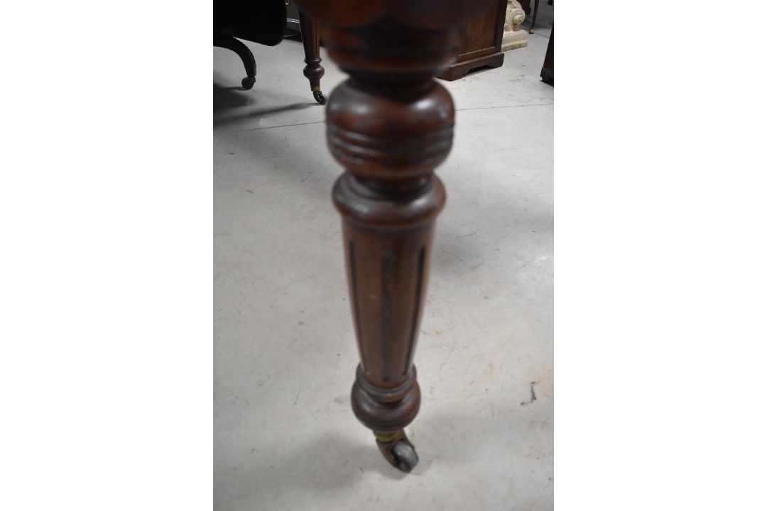 A late Victorian mahogany extending dining table, of rectangular form with moulded edge detail and - Image 3 of 3