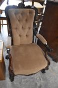 A Victorian mahogany scroll armchair , having button back dralon upholstery
