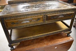 A modern Chinese style camphor wood coffee table, with two drawers to frieze and shelf under,