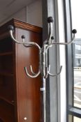 A modern chrome coat stand in the vintage style