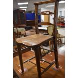 A 19th Century rustic childs correction style chair having turned frame with double stretcher,