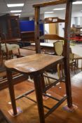 A 19th Century rustic childs correction style chair having turned frame with double stretcher,