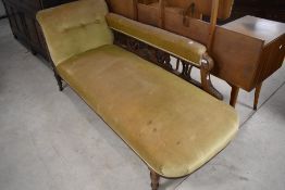 A Victorian mahogany framed chaise longue having ochre dralon upholstery