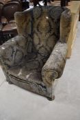 A late 19th or early 20th Century upholstery project armchair, width approx. 91cm