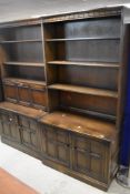 Two 20th Century dark stained wall units in the Ercol or Old Charm style