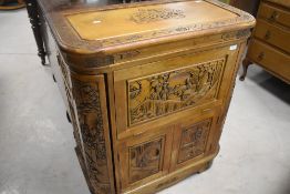 An Oriental drinks cabinet having top and front openings, dimensions approx. Width 78 depth 41