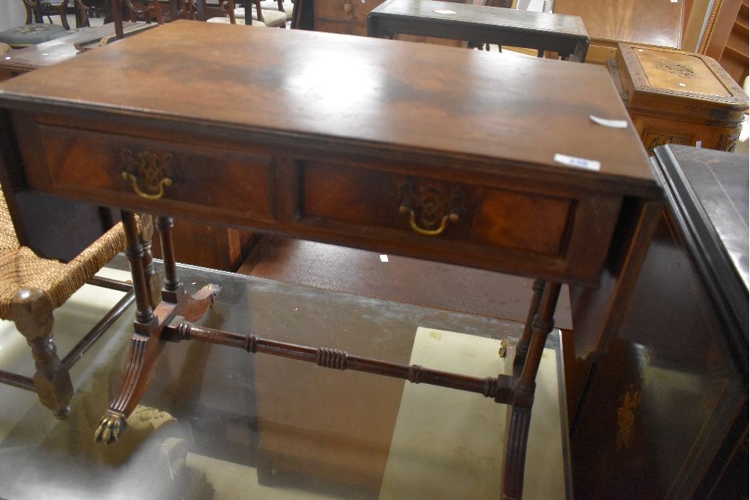 A reproduction Regency sofa style drop end coffee table, having two frieze drawers, approx. 65 x